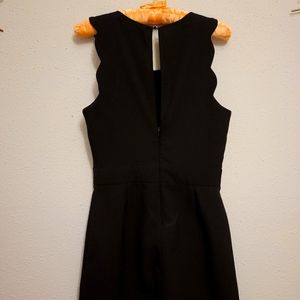 black scalloped body suit.